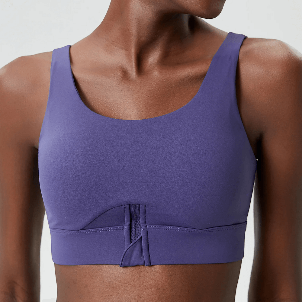 Woman wearing a purple Vibrant Yoga Fitness Bra, breathable sportswear SF2092, ideal for high-impact workouts, featuring anti-friction weave.